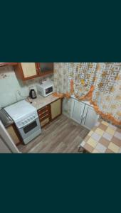 Η κουζίνα ή μικρή κουζίνα στο Квартира напротив НУР-ОТАН