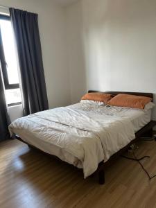 Postel nebo postele na pokoji v ubytování Tuan Residency