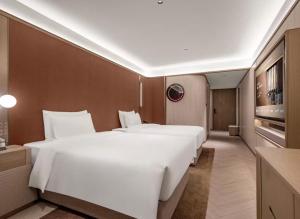 Fotografie z fotogalerie ubytování Orange Crystal Qingdao Taidong Pedestrian Street Yan'an Third Road Hotel v destinaci Čching-tao