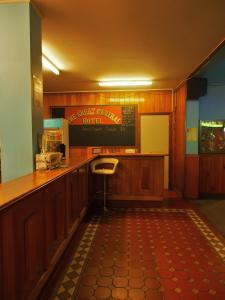 a kitchen with a sink and a counter at Great Central Hotel in Glen Innes