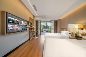 Ένα ή περισσότερα κρεβάτια σε δωμάτιο στο Yangji Yueya Hotel