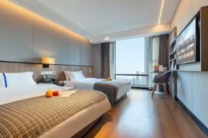 Ένα ή περισσότερα κρεβάτια σε δωμάτιο στο Yangji Yueya Hotel +17 φωτογραφίες