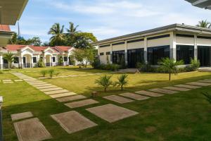 パングラオにあるBliss Suites by SMS Hospitalityの庭のある家