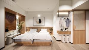 a bedroom with a large white bed and a bathroom at Bogorienze City Resort in Pamoyanan +34 photos