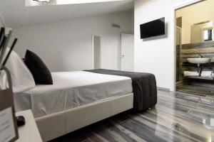 Postel nebo postele na pokoji v ubytování B&B al Palazzo