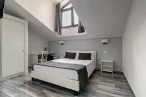 Postel nebo postele na pokoji v ubytování B&B al Palazzo