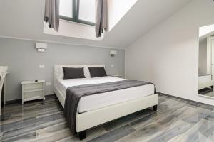 Postel nebo postele na pokoji v ubytování B&B al Palazzo