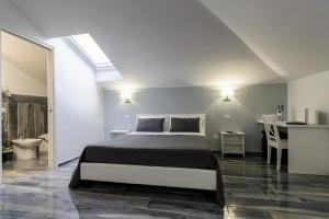 Postel nebo postele na pokoji v ubytování B&B al Palazzo