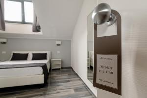 Postel nebo postele na pokoji v ubytování B&B al Palazzo