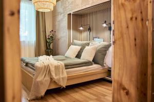 Ένα ή περισσότερα κρεβάτια σε δωμάτιο στο Casa Francesco - Ruhiges Apartment nahe Riesneralm & Planneralm