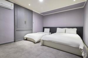 Postel nebo postele na pokoji v ubytování 인천 서구 연호텔