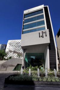 a building with a hil sign on the side of it at LiT BANGKOK Hotel - SHA Extra Plus in Bangkok