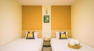 Giường trong phòng chung tại New Suanmali Hotel +115 ảnh