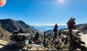 a view of a valley with mountains in the background at shree krishna resorts in Pokhri