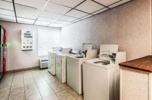 a row of washers and dryers in a room at Comfort Inn & Suites Alexandria West in Alexandria +47 photos