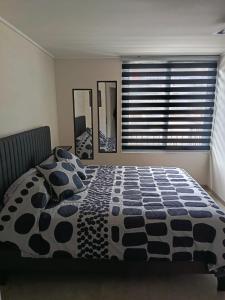 Ένα ή περισσότερα κρεβάτια σε δωμάτιο στο Suite urbana