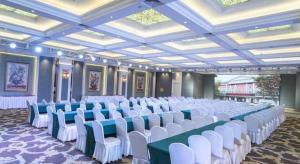 a large room with rows of chairs and tables at Zaozhuang Hotel in Zaozhuang +267 photos