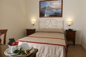 En eller flere senge i et værelse på Dimora delle Arti