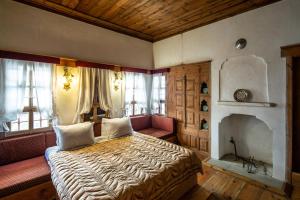 a bedroom with a bed and a fireplace at Gulevi Safranbolu Heritage Hotel in Safranbolu +239 photos