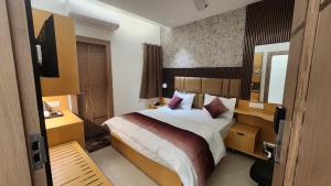 En eller flere senge i et værelse på Somnath Palace