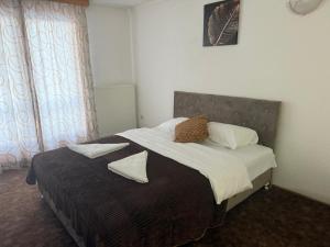 Ένα ή περισσότερα κρεβάτια σε δωμάτιο στο Planinska kuća Vlašić