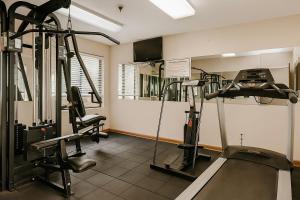 a gym with two tread machines and a treadmill at Quality Inn & Suites Circleville in Circleville