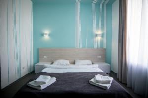Postel nebo postele na pokoji v ubytování Volna Hotel