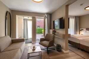 Ένα ή περισσότερα κρεβάτια σε δωμάτιο στο Hotel am Schlosspark garni