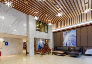 TV a/nebo společenská místnost v ubytování City Comfort Inn Dongguan Nancheng Tian'an Digital City