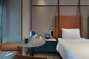 Ένα ή περισσότερα κρεβάτια σε δωμάτιο στο FunGee S