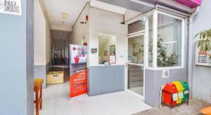 a store front with a large glass door in a room at RedDoorz near Cebu Metropolitan Cathedral in Adlawon