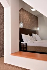 Voodi või voodid majutusasutuse Hotel Atrium toas