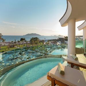 a swimming pool with a view of the ocean at Liberty Signa in Fethiye