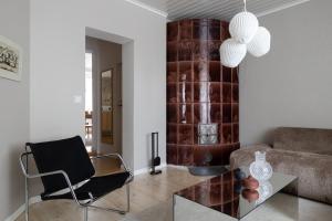 a living room with a couch and a table at Stylish & Cozy 1BR Apt in Historical Neighborhood in Tampere +11 photos