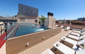 a swimming pool on the roof of a building at Park Hotel in Barcelona