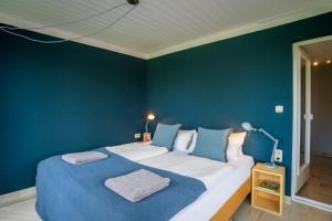 Ένα ή περισσότερα κρεβάτια σε δωμάτιο στο Häuschen mit privatem Schleizugang