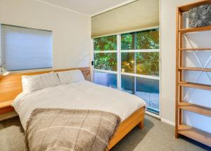 Ένα ή περισσότερα κρεβάτια σε δωμάτιο στο Wellington Seaside Haven +11 φωτογραφίες