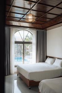 En eller flere senge i et værelse på Tamcoc peacefull