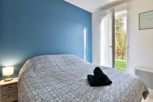 Ένα ή περισσότερα κρεβάτια σε δωμάτιο στο Chez Josse - A 10 min de St-Cast