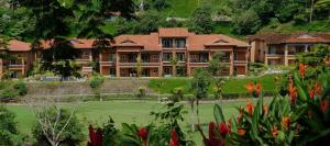 a large building with a lawn in front of it at Veranda 4B - 3bdr 3bath in Isla Herradura