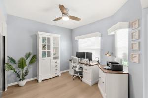 an office with a desk with a computer and a fan at Ocean Oaks PHB-8 in Cape Canaveral +42 photos