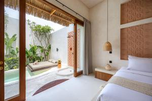 Ένα ή περισσότερα κρεβάτια σε δωμάτιο στο Villa Akuna 1
