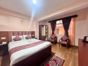 En eller flere senge i et værelse på Rare Himalayas Mansarovar + 4 billeder