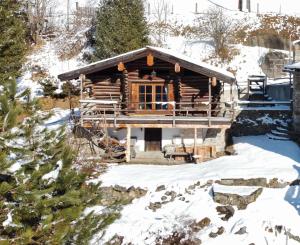 a log cabin with snow on the ground at Almliesl GAST-756 in Bad Hofgastein +1 photo