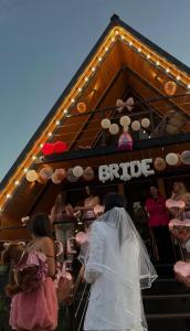 a bride and groom walking up the stairs of a bar at Oda to Didvela -ოდა დიდველაში  +42 photos