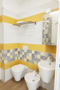 a bathroom with a toilet and a sink at Villa Antonietta Ischia in Ischia +38 photos