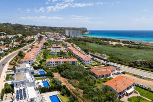 an aerial view of a resort next to the ocean at Villa Paradise by Escape Home in Son Bou