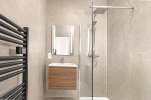 a bathroom with a shower and a sink at New Panoramic studio overlooking Monaco in Beausoleil