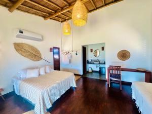 Postel nebo postele na pokoji v ubytování Amigos do Vento Chalés e Kite Point