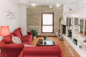 Un lugar para sentarse en Palladio Apartment - In Centro con Garage, Vista Fiume, Jacuzzi